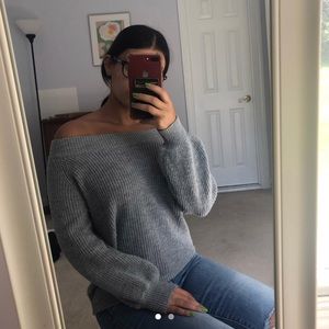 over-the-shoulder grey sweater